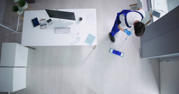 Stylish office interior with polished marble floors and bright white walls, reflecting the brand of Corporate Cleaning Solutions.