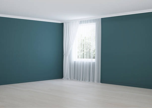 Empty room with blue walls and a white floor, suitable for floor cleaning and maintenance activities.