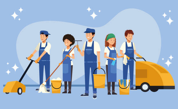 A group of people engaged in cleaning the floor as part of commercial cleaning services.